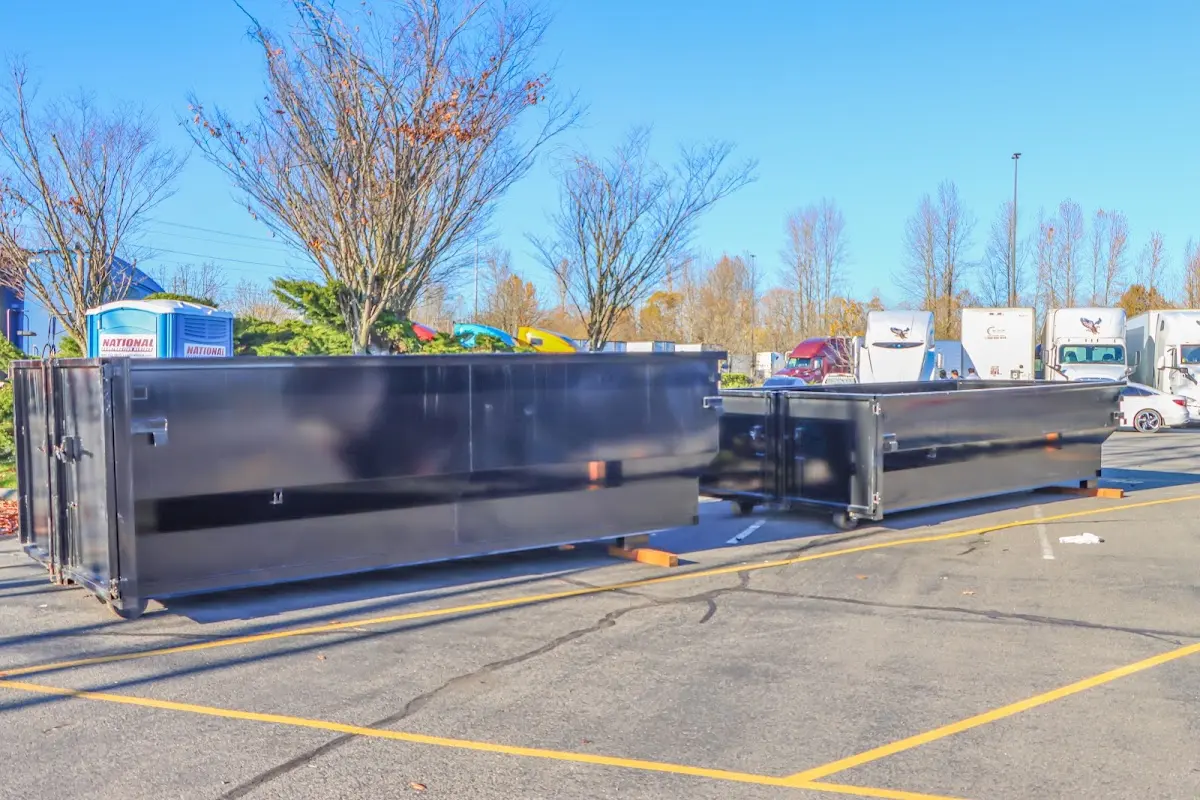 Professional dumpster rental service with roll-off container on residential driveway in Glendale